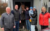 Andrew Kinirons (centre) with his dad Eddie, Martin Heydon TD, Minister for Agriculture; Andrew's fiancée Teresa holding their daughter Danni alongside his mam Dorothy with Luker's Tipple