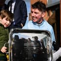 Jockey Donagh Meyler with his nephew Jim Kelleher, age 3, after winning the BOYLE Sports Irish Grand National Steeplechase on Soldier In Milan, Photo by Seb Daly/Sportsfile