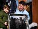Jockey Donagh Meyler with his nephew Jim Kelleher, age 3, after winning the BOYLE Sports Irish Grand National Steeplechase on Soldier In Milan, Photo by Seb Daly/Sportsfile